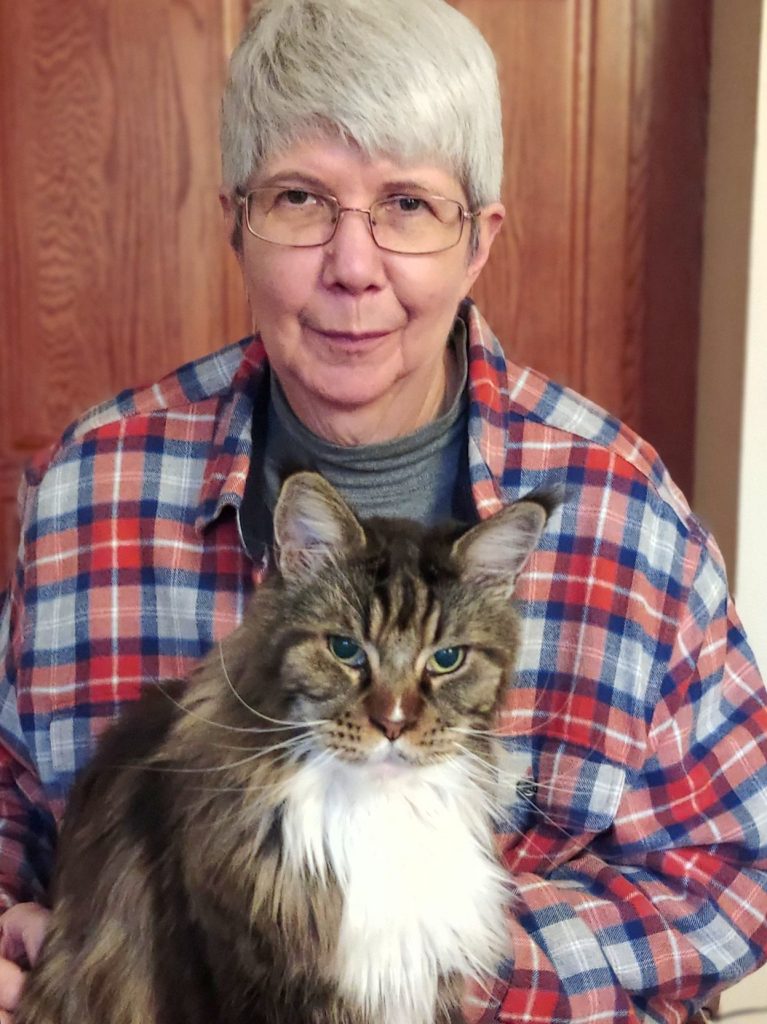 A portrait of an author with her cat